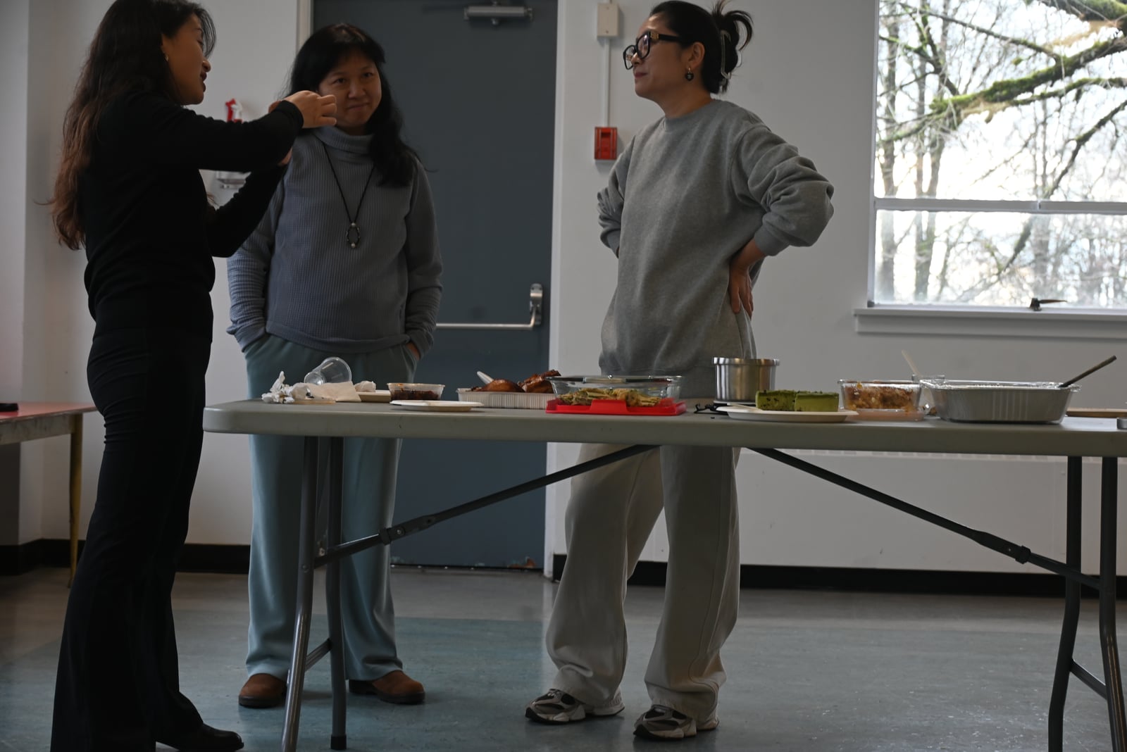 Participants sharing food and conversation at the Open Arms cultural exchange
