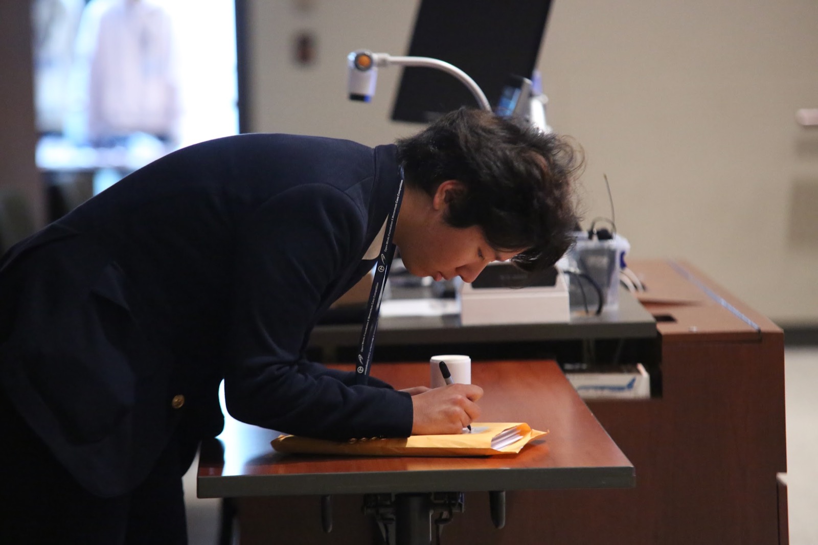 A Momentum participant making notes while working through the case