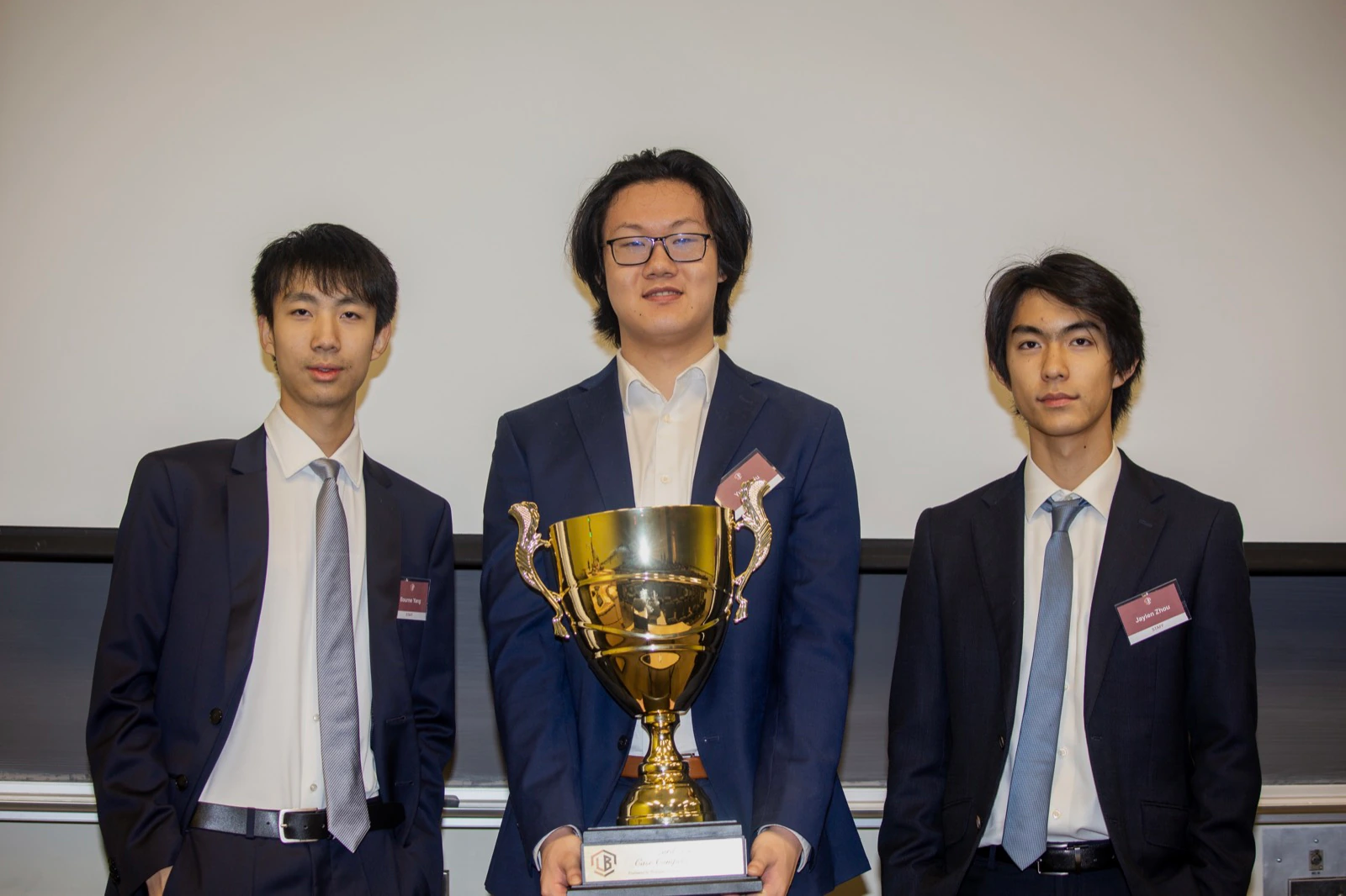 The winning team holding the trophy at the Lord Byng Case Competition